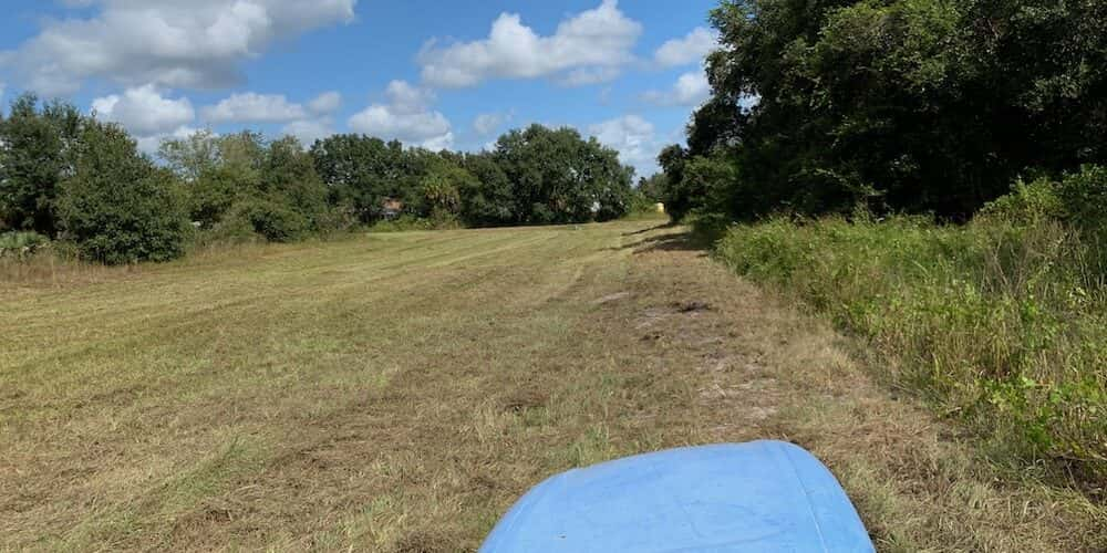 Bush hogging and mowing residential acreage.